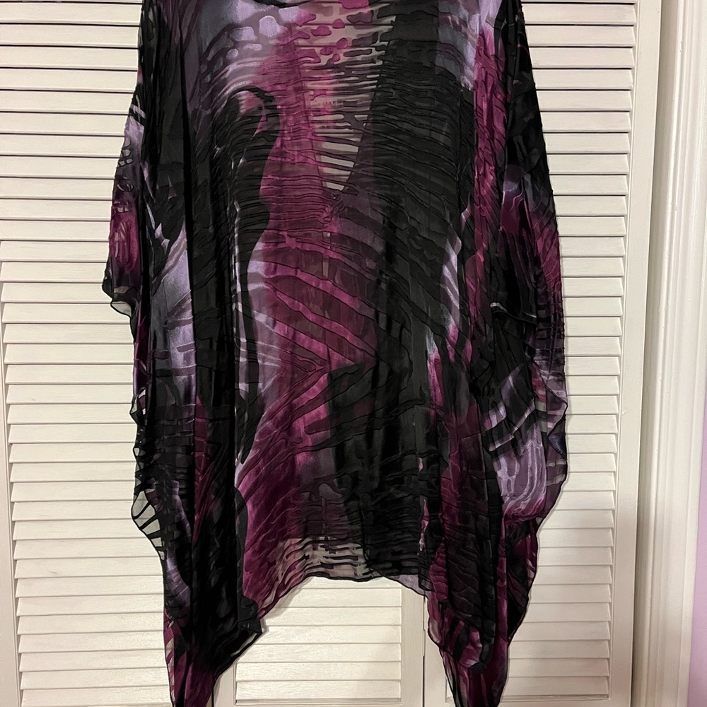 Light weight flowy chiffon kimono cardigan style. One button opening.